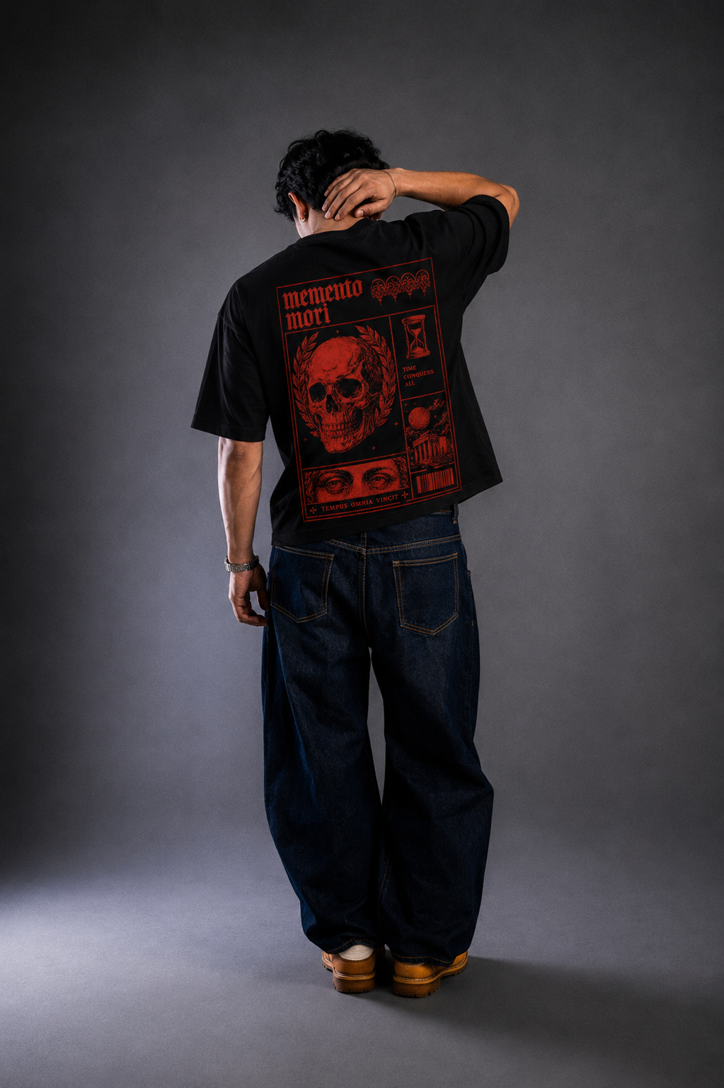 9ELIXIR Memento Mori oversized tee — red skull broadsheet graphic on black cotton, front
