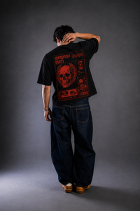 9ELIXIR Memento Mori oversized tee — red skull broadsheet graphic on black cotton, front